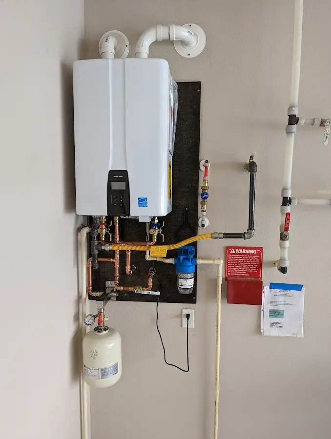 Professional plumber installing copper piping in a Dardanelle home